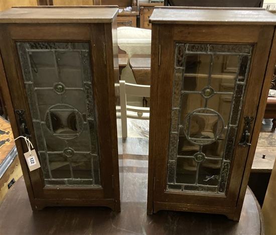A pair of oak and leaded glass side cabinets, width 32cm, depth 21cm, height 64cm